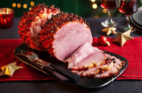 Gammon is a Christmas classic. In this 4-ingredient recipe, we've coated the meat with a sticky marmalade and brown sugar glaze. Try this as a great gluten-free, festive main course alternative.
