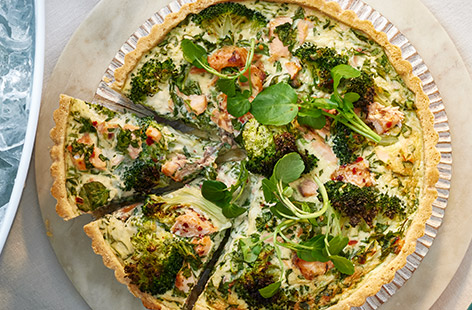 Impressive-looking and simple to make, this quiche uses shortcuts like ready rolled pastry and hot-smoked salmon fillets to save on time