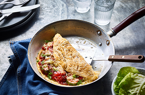 A box of eggs and plenty of veg is all you need to whip up a batch of these ratatouille omelettes. This easy omelette recipe is filled with a Med veg medley with courgettes, peppers and onions in a rich tomato sauce, finished with melting cheese.