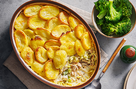 Frozen veg and tinned fish create this brilliant, budget-friendly fish pie recipe that's super-simple, speedy and tasty. Tinned salmon and mackerel lend big flavour, while the frozen roast potatoes provide a crunchy, crisp topping. There's even a broccoli hidden in the filling!