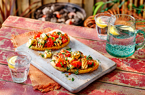 Take a classic bruschetta to the next level with smoky barbecued halloumi and sweet vine tomatoes. Tossed in extra virgin olive oil, fresh basil and served on toasted sourdough bread, making a lovely light lunch or barbecue starter.