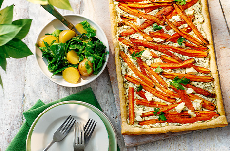 Sweet roasted carrots and tangy salad cheese top this tart for a dinner that's made for enjoying in the sun
