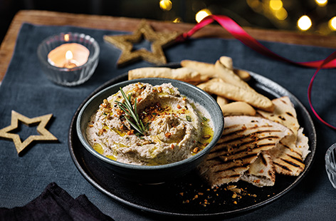 Keep party guests going with a simple roasted garlic white bean dip. Roast a bulb of garlic until sweet and caramelised, then blitz with cannellini beans and fragrant rosemary. Make ahead of time then serve with gluten-free flatbreads, crackers or crudité.