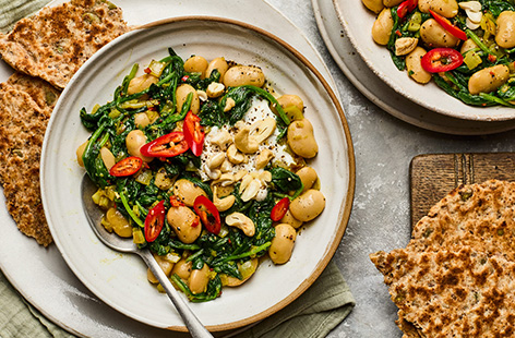 Packed with flavour, this high-fibre veggie curry takes its cue from a beloved Indian classic and transforms it into a speedy midweek winner. Seasoned with aromatic spices and served with homemade flatbreads for scooping up every last bite, it's a healthy, fuss-free recipe you'll come back to time and time again.
