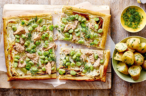 This easy puff pastry tart is topped with soft cheese, tinned salmon, broad beans and dill, giving it a wonderful light and spring-like flavour. Serve with new potatoes for a lovely family dinner.