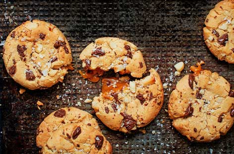 Serve these cookies freshly baked and still warm to truly experience the gooeyness of the caramel centres and the deliciousness of the melt-in-the-mouth chocolate chips.