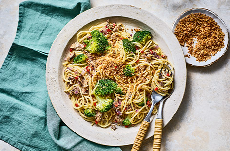 Sardines, broccoli and spaghetti are topped with garlicky, zesty breadcrumbs for a super-tasty and speedy family meal. Stock tins of fish in your cupboard so you can make this delicious and very affordable dinner every week!