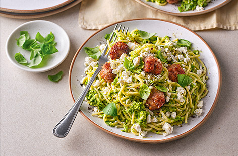 Here's a new pasta recipe to add to your collection – make tasty meatballs with a pack of sausages and whizz up a homemade pesto with frozen peas. A new family favourite! 