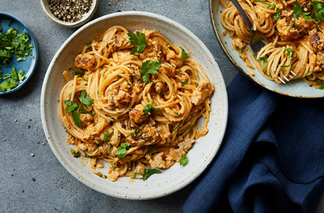 This simple sausage spaghetti is the perfect dinner after a busy day. Fry off the sausages until they're nice and crispy then stir through a stroganoff-style creamy sauce. It's hearty, warming and on the table in 30 minutes.