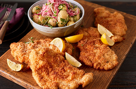 In this Czech-inspired dish, crispy chicken schnitzels are served alongside a warm potato salad with a zingy honey and mustard dressing