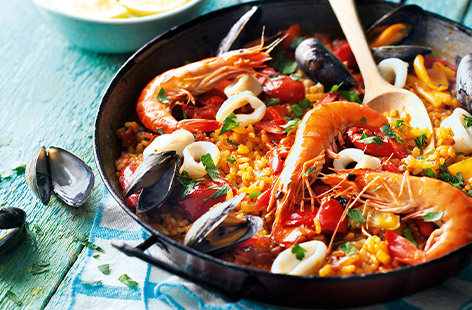 Make your paella punchy with saffron-infused fish stock and carefully placed fresh tiger prawns, mussels and squid