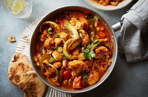 Chilly winter evenings call for a bowl of this warming veggie stew. Packed with cauliflower, sweet potatoes and cannellini beans, serve with toasted pitta breads for dipping into that smoky tomato sauce.