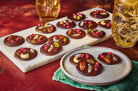 These elegant chocolate discs are studded with dried fruit, nuts and crystallised ginger for a touch of spice