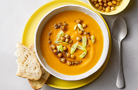 This sweet potato soup is subtly spiced with ginger and ground cumin making it ideal for all the family. Serve it topped with crispy chickpeas and spring onion.