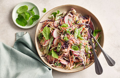 This slaw is super-flexible, you can use up whatever veg or herbs you have kicking about. Try using kale, Savoy cabbage, sprouts, fennel, celery, celeriac, beetroot, courgette, white or red onion, or apple.