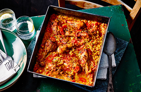 Let the oven do the work with this easy chicken traybake recipe. Combine red lentils, tomatoes and spices and roast with chicken drumsticks for a simple one-pan meal. 