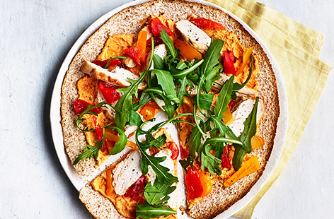 With just a handful of ingredients – and a packet of wholemeat tortilla wraps – you can rustle up these spiced houmous and chicken 'pizzas'