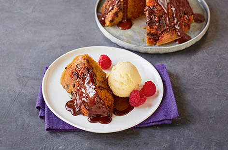 The perfect way to end a meal, this light sponge is covered in hot chocolate sauce and studded with dark chocolate chips; serve with ice cream and a few raspberries, if you like