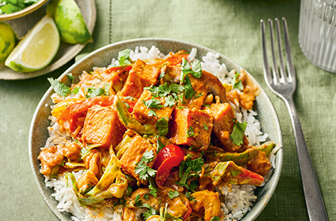 Cubes of stir-fried tofu and veggies are coated in a gorgeous peanut butter sauce then piled onto a bed of fluffy rice. A super-speedy dinner that everyone will love, whether you're vegan or fancy something plant-based.