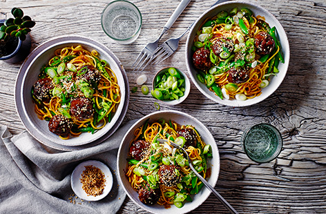 Meatballs are a great midweek staple, so try this sticky hoisin meatball traybake recipe for something a little bit different. Meatballs are baked in a hoisin glaze for an easy method, then tossed with noodles and sugar snaps for a 30-minute meal.