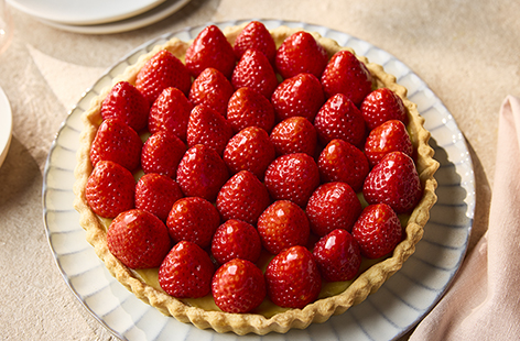 This classic strawberry tart filled with luxe crème pâtissière makes a stunning dessert for summer hosting or a family gathering. This recipe requires a little prep and patience, but the effort is totally worth it. Celebrate seasonal strawberries and impress everyone with this beautiful creation!