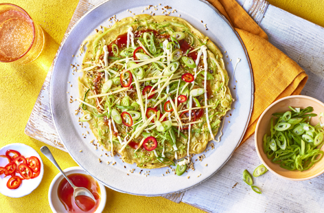 Okonomiyaki is a Japanese-style savoury pancake. In our version, we mix sweetheart cabbage and spring onions in the pancake batter, then top with pickled ginger and red chillies. This is a great for a weekend brunch or quick lunch.