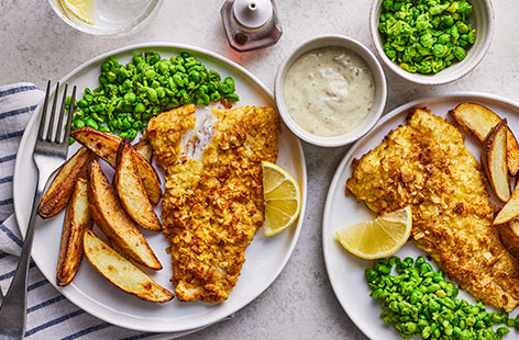 Recreate your favourite chippy dinner at home with the help of your air-fryer. Use whatever fish you fancy, then coat in salt and vinegar crisps for a crunchy coating. Serve with proper chips and minty peas.
