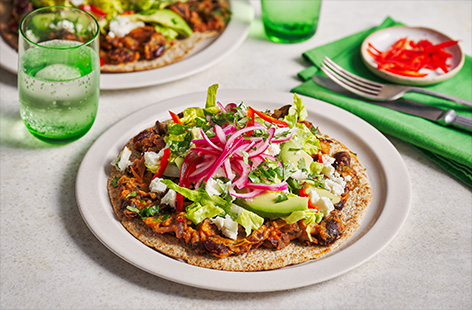 Top crispy wholemeal tortillas with spiced kidney beans and all your favourite Mexican-inspired flavours.