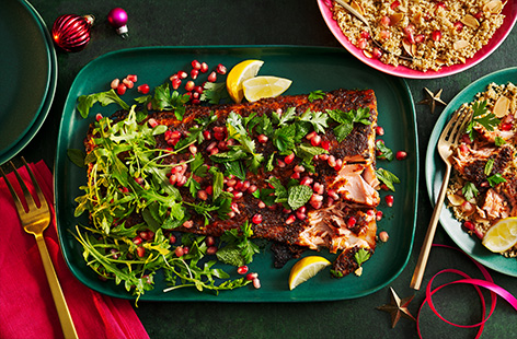 Coat salmon with a sticky maple and ras el hanout glaze and serve on a bed of zesty couscous. This is a great alternative to a classic Christmas dinner.