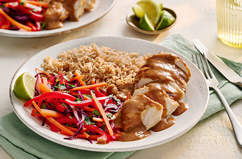 Juicy chicken breasts are marinaded in a store cupboard-friendly satay sauce and cooked in the air-fryer until golden. Served alongside a crunchy slaw and hearty brown rice, a deliciously healthy dinner.