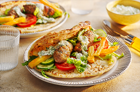 The whole family will enjoy these delicious pork koftas. Serve with flatbreads, homemade chips and fresh tzatziki and let everyone load up their plates.