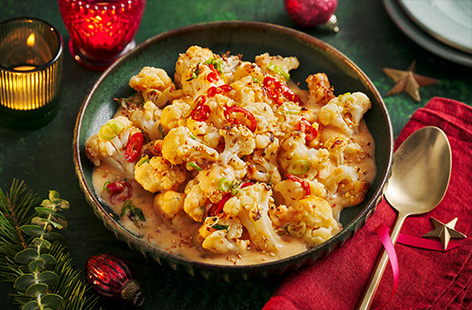 Take your cauliflower cheese to the next level with our spicy version. Make an easy bang bang-style sauce with sriracha and sweet chilli, then cook in the air-fryer for extra crispiness.