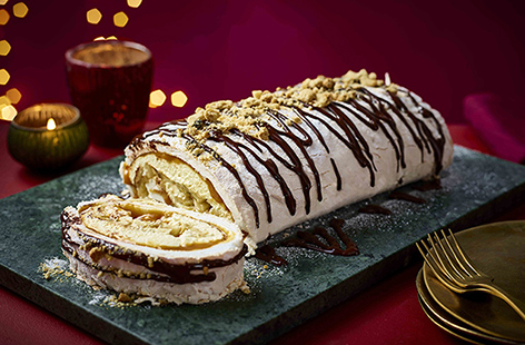 Wow your guests with this show-stopping yet budget-friendly chocolate banoffee roulade. With a rich caramel, banana, and chocolate filling wrapped in light meringue, it's perfect for festive parties or as a decadent Christmas dessert.