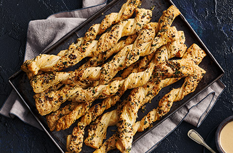 A quick and easy party food recipe made with puff pastry and a gorgeous mix of tahini, garlic and parsley.