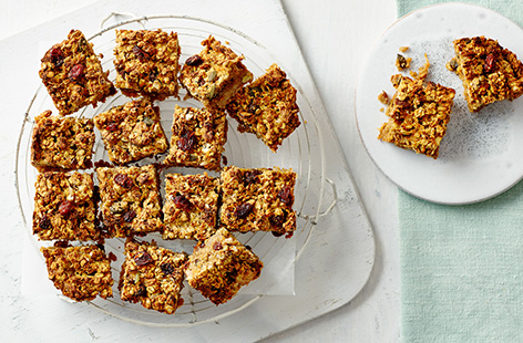 Transform your favourite cake into a healthy snack. Made with peanut butter and bananas, these carrot cake bars are a great on-the-go nibble. 