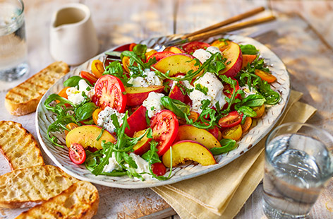 Fresh peaches, juicy tomatoes and creamy burrata make a summery trio in this 15-minute salad