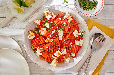 Amp up a classic watermelon and feta salad with Tesco Fire Pit The Hot One marinade. Watermelon slices are marinated in the habanero chilli and lime mixture before being grilled and topped with feta and fresh mint in this fun, easy vegetarian barbecue side.