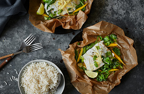 These Thai fish parcels are the perfect stress-free dinner. Simply wrap cod, spinach and peppers in baking paper with a drizzle of fragrant ginger and lime dressing and bake in the oven. Unwrap and serve with rice and fresh coriander.