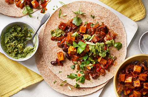Smoky and zingy, these easy vegan fajitas are packed with veg. Get the tofu nice and crispy in the pan before adding in your peppers and kidney beans for a great mix of textures. Serve with a quick homemade guacamole and serve it up 'family style'.