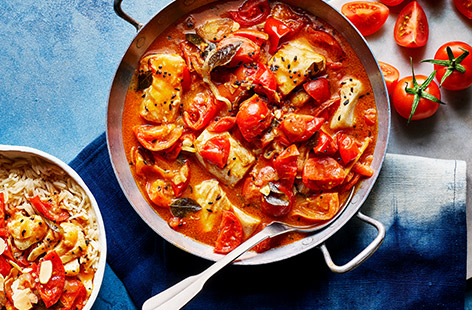 This colourful one pot curry is packed with flavour and aroma. Juicy tomatoes and creamy coconut milk make this delicious dairy-free and gluten-free dish perfect for a comforting weeknight dinner.
