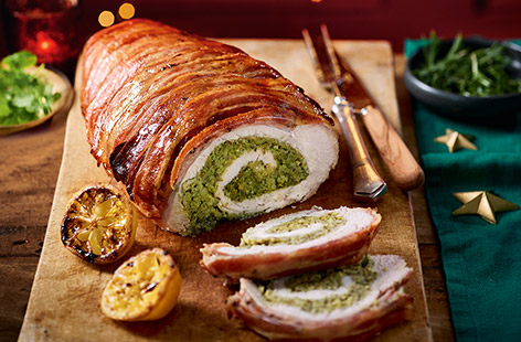 This stunning centrepiece is totally worth the extra effort. Stuffed with a flavoursome pesto, wrapped in bacon and glazed with maple syrup, this is a perfect push-the-boat-out recipe for your Christmas lunch. There are seven steps, but follow our tried-and-tested method for stress-free success.