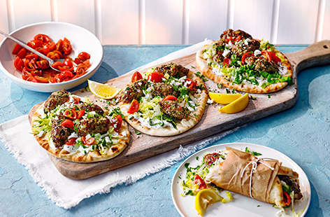 Make these turkey kofte flatbreads for an easy dinner idea. Herby courgette and turkey kofte are griddled until juicy, then load onto flatbreads with tangy garlic yogurt, lettuce and crumbled cheese, plus a simple tomato salad to serve. 