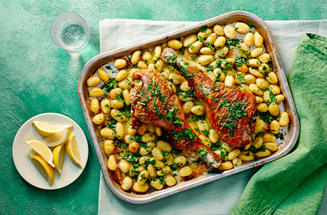 Turkey isn't just for Christmas. These easy turkey legs cook slowly in the oven resulting in a juicy, tender, fall-apart piece of meat served with crispy gnocchi and a scattering of fresh parsley