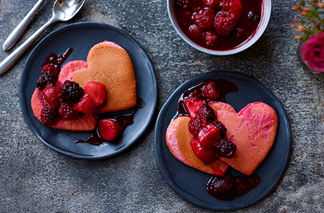 Kick off your Valentine's Day with a special breakfast in bed by making these cute heart-shaped pancakes. Made using pancake mix for an easy shortcut, serve these pretty pink pancakes with a warm berry and citrus compote for a super-sweet start to your Valentine's Day.