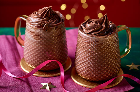 Have you ever seen such an indulgent hot chocolate? The good news is you don't actually need chocolate for this recipe – the rich creaminess comes from a storecupboard ingredient – cocoa powder. Ready in 10, this is the ultimate festive drink to enjoy on Christmas eve or on any cosy night in.