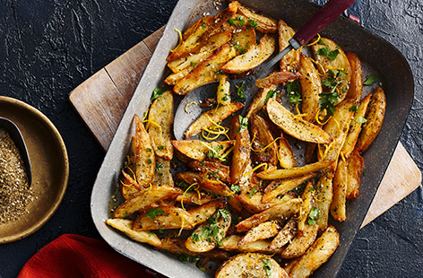 Za'atar – a herb, seed and spice mix – makes a wonderfully fragrant seasoning for these crispy potato wedges.