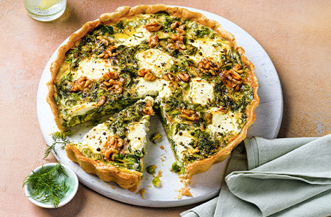 Get your greens in with this super easy quiche. With goat's cheese, walnuts and dill, try this quiche for a light dinner or picnic main.
