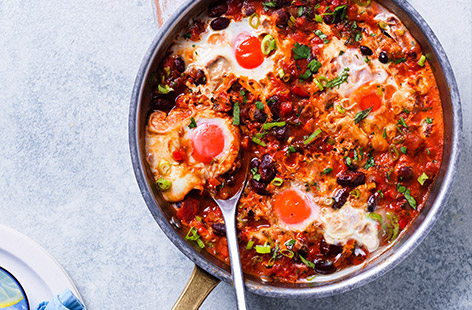 This Mexican-inspired baked eggs recipe is actually cooked on the hob, making it quick and easy, just pop the part-baked baguettes in the oven. Super-tasty and comforting, everyone will be asking for this again.