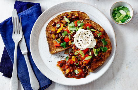 For a quick and easy midweek family meal, try this colourful vegetarian chilli beans on toast, packed with tongue-tingling fajita flavours and hearty black beans