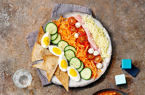 We've used mozzarella, cucumber, tomatoes, carrot, eggs and ham on this kid's salad recipe but you could change any of the ingredients for your child's favourite. 